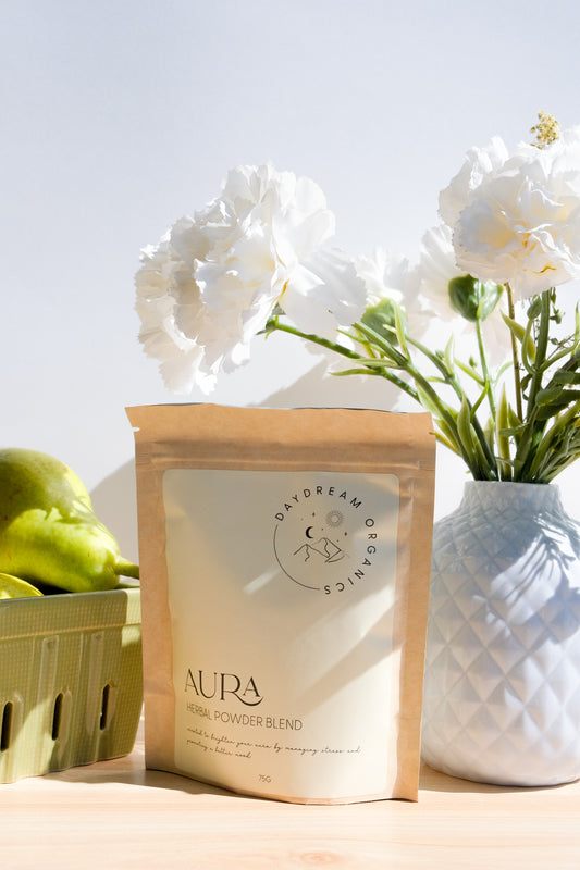 Our Aura Herbal Powder blend has been mindfully created to nurture a positive mood and promote a sense of tranquility in the mind and body.
This blends of herbs offers a gentle way to support emotional well-being and manage everyday stressors. With its soothing properties, Aura can be seamlessly incorporated into your daily routine, helping you to find a sense of balance and enhance your overall aura. 