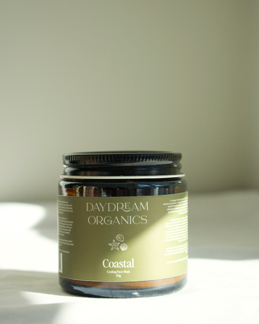 Our Coastal Face Mask is a mineral-rich clay mask that's infused with refreshing Sea Kelp and Spirulina. This mask gently cleanses the skin by drawing away excess oil and dirt while also leaving the skin feeling fresh, smooth and renewed. A touch of Peppermint essential oil creates a cooling sensation that helps to refresh warm, red, flushed skin while Blue Tansy provides soothing, comforting properties.
