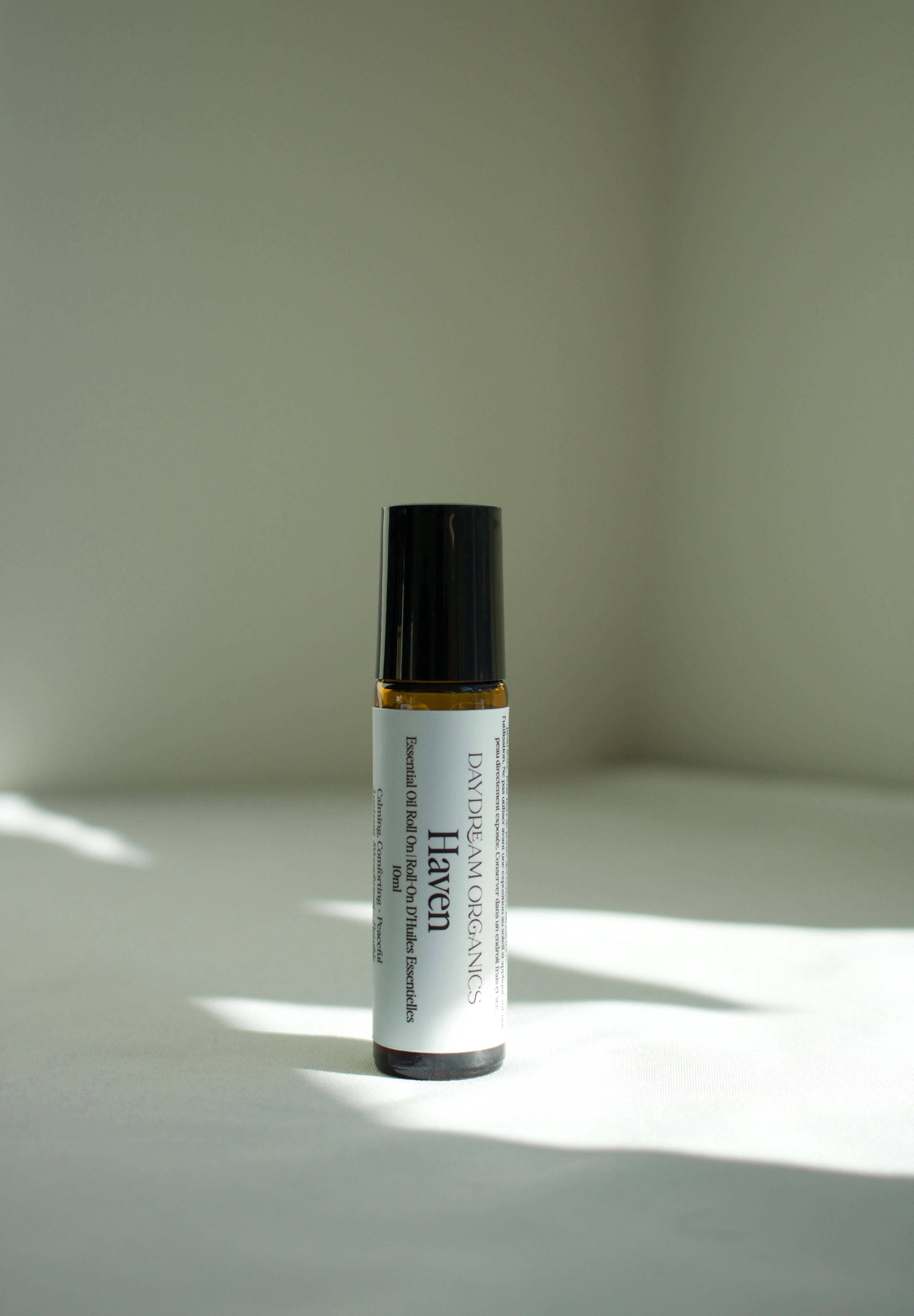 Our Haven essential oil roll-on has been created to transport you into a safe haven of your very own. This blend is serene, tranquil and sweet, creating a sense of ease, calm, and stillness - a perfect companion for quiet moments, deep breaths, and finding comfort within.